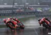 MotoGP 22 Image of Bikes turning in rainy weather