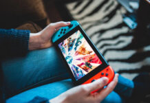 How to make money playing video games - person playing Nintendo Switch